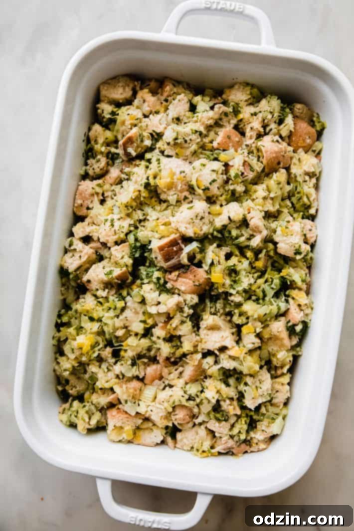 unbaked stuffing in white baking dish