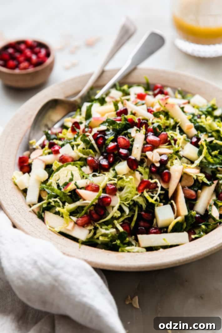 prepared Brussels sprout salad in bowl with fork and spoon