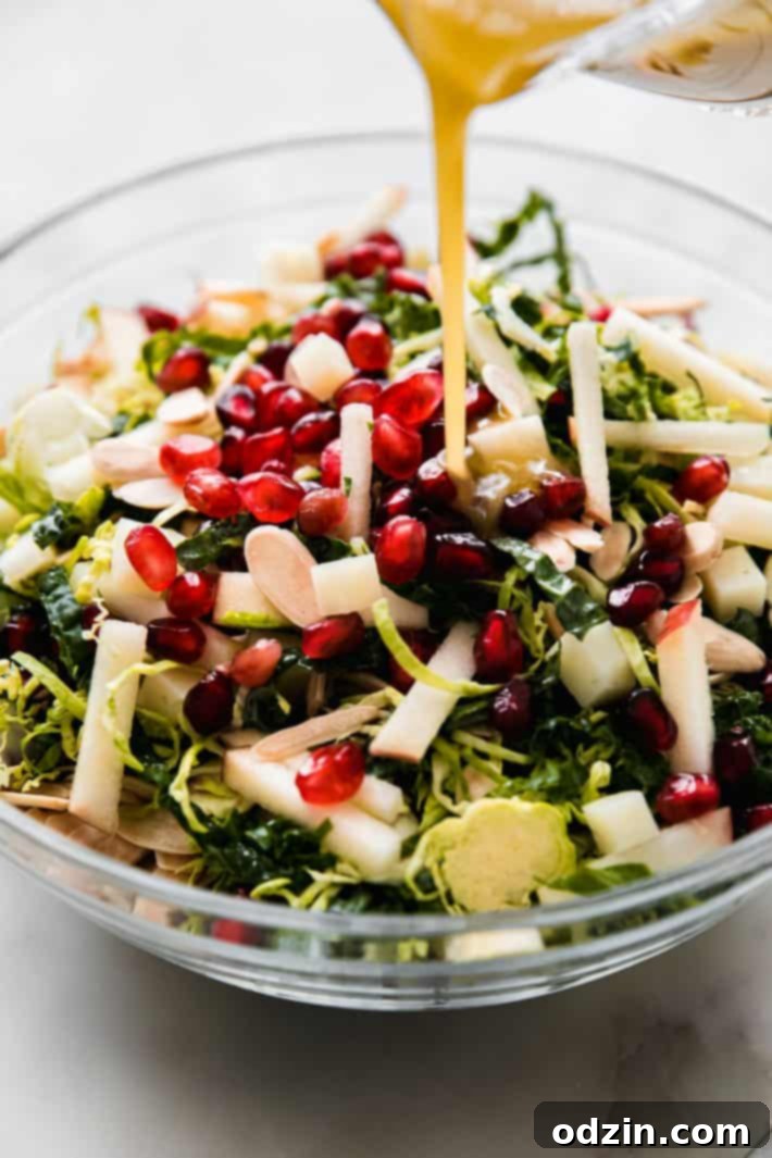 pouring dressing over sprout salad