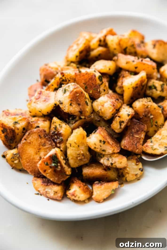 Fiery Lebanese Potatoes 3 roasted potatoes on plate