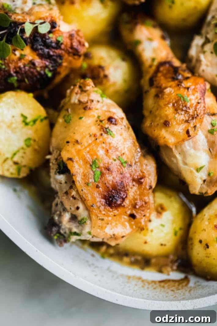 roasted chicken over lemony potatoes