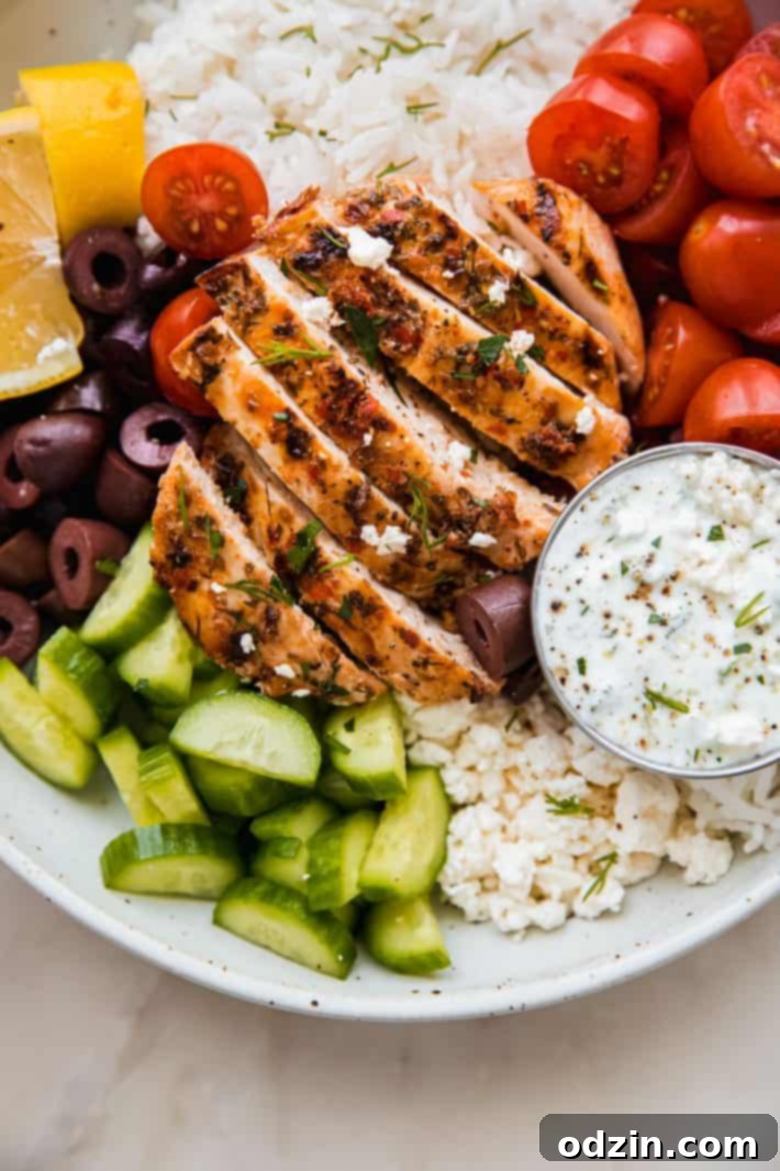 chicken tzatziki bowls topped with cucumbers, feta, olives, and tomatoes