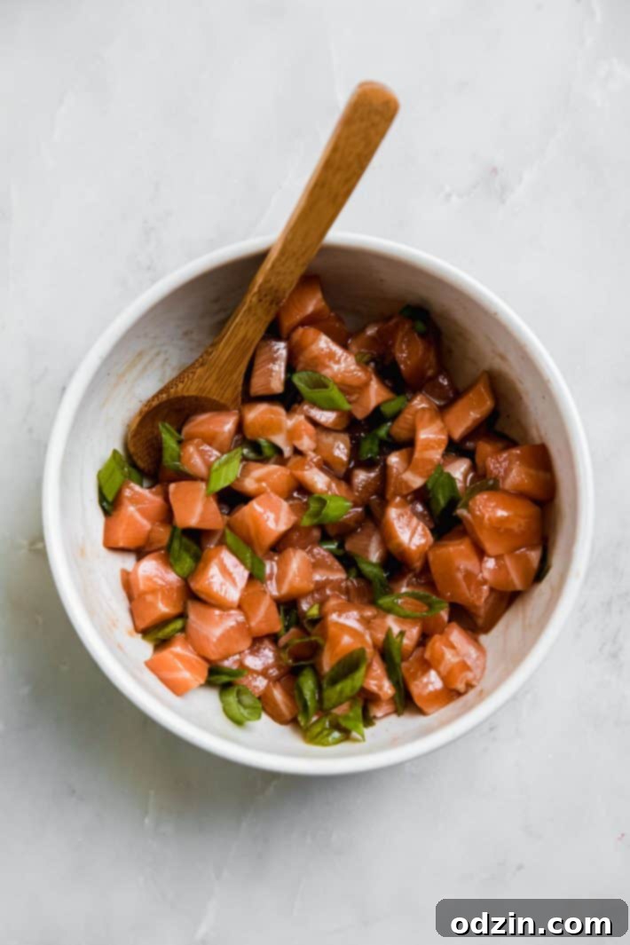 Spicy California Sushi Wonton Nachos 5 sushi grade salmon in bowl with soy sauce and scallions