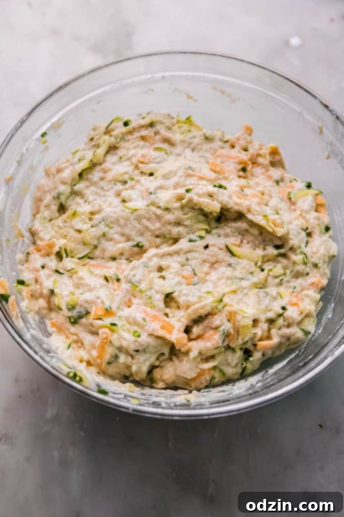 batter for zucchini muffin in clear bowl