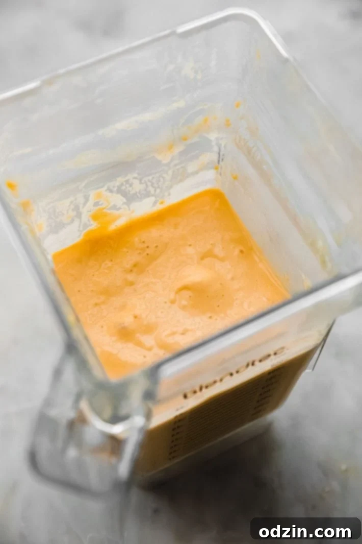 blended yogurt with milk and mango in blender