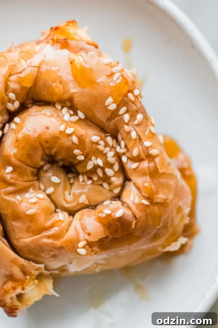 Crispy Feta Cheese Phyllo Pastry Spirals with a hot honey drizzle, presented as an elegant appetizer.