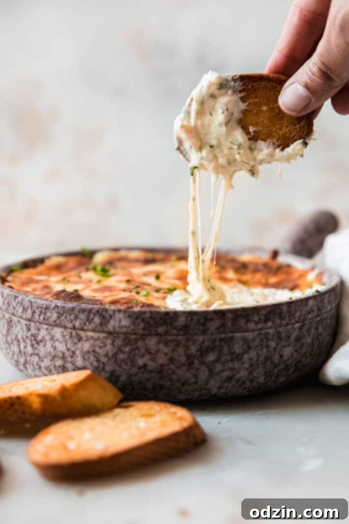 cheese pull on bread from dip bowl