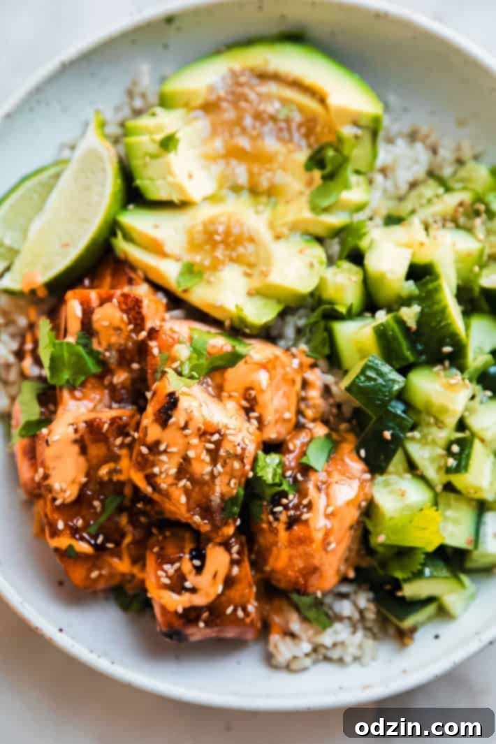 salmon bowls with avocado, cucumbers, and honey lime sauce