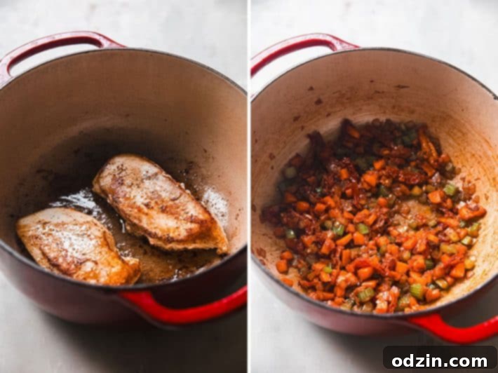 The Ultimate Marry Me Chicken Soup 4 seared chicken and sautéed vegetables in cast iron pot for marry me chicken soup
