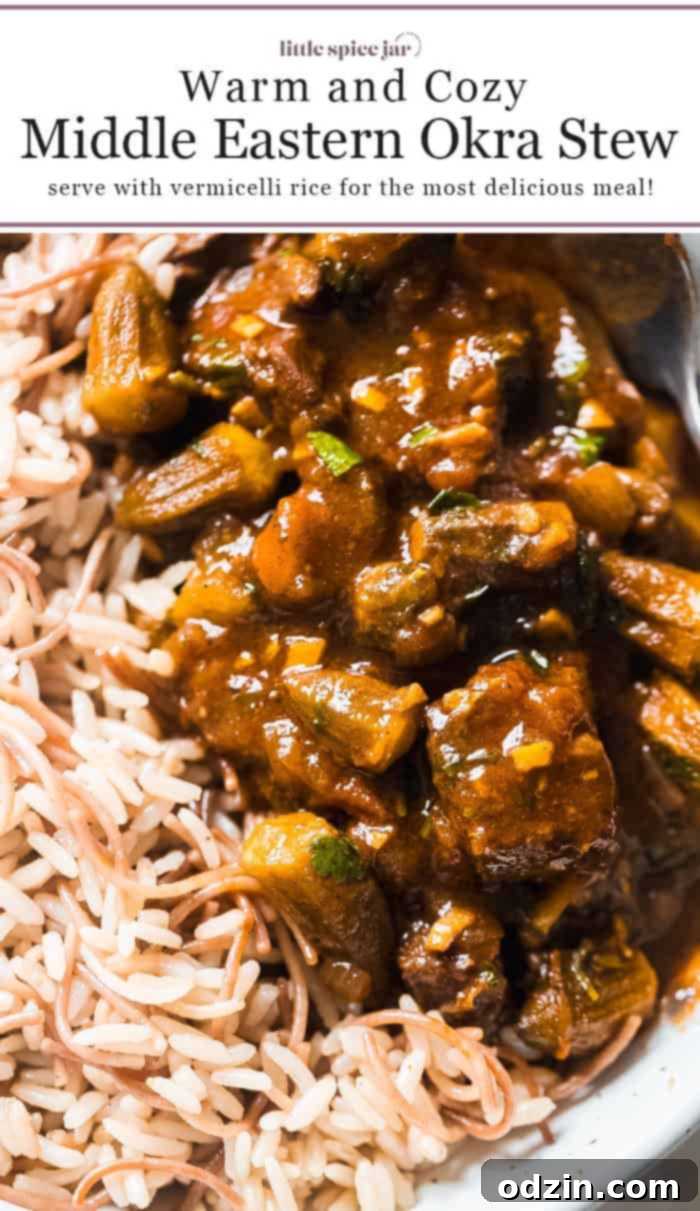 Middle Eastern Okra and Beef Stew (Bamya) in a bowl with rice, ready to eat.