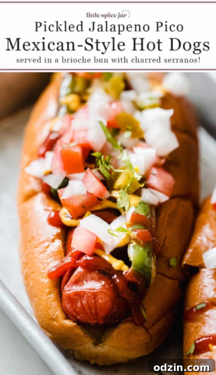 Mexican hot dog with pico de gallo and charred serrano peppers