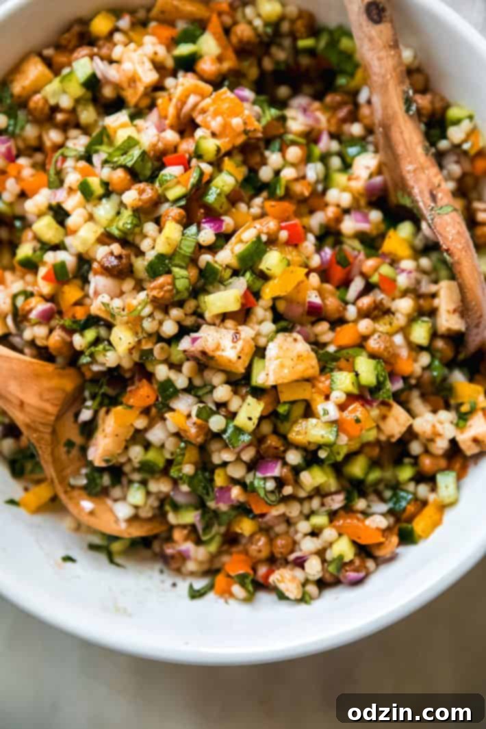 Lemon Mint Halloumi Salad 3 close up of fried halloumi cheese with cucumbers, pearl couscous, chickpeas and more