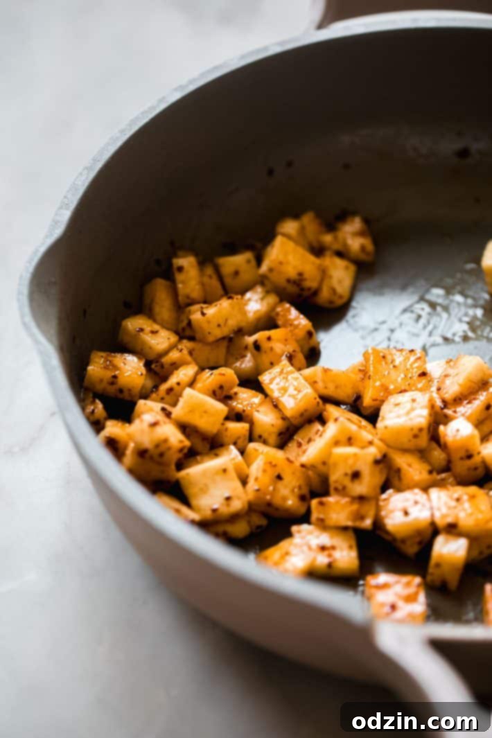 Lemon Mint Halloumi Salad 5 fried halloumi in pan with hot honey and Aleppo pepper