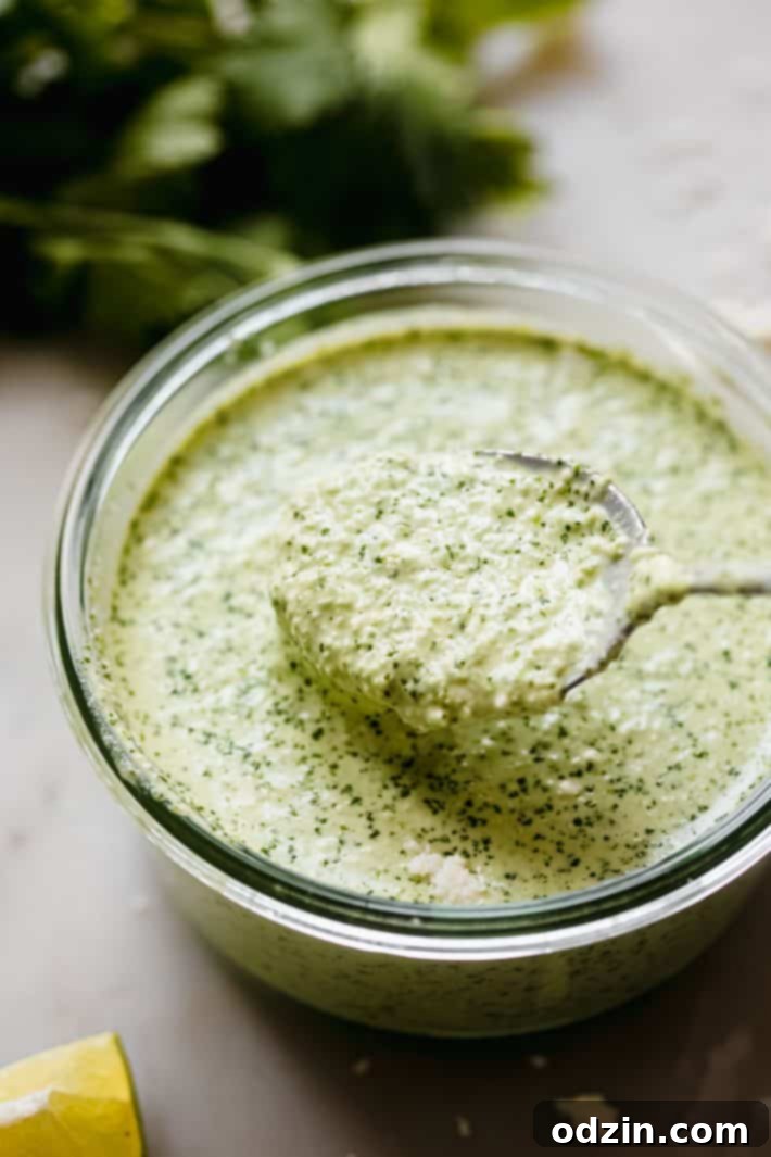 Peruvian Aji Verde Sauce 6 Small bowls filled with luscious Peruvian green sauce, elegantly arranged with a serving spoon, inviting tasters.