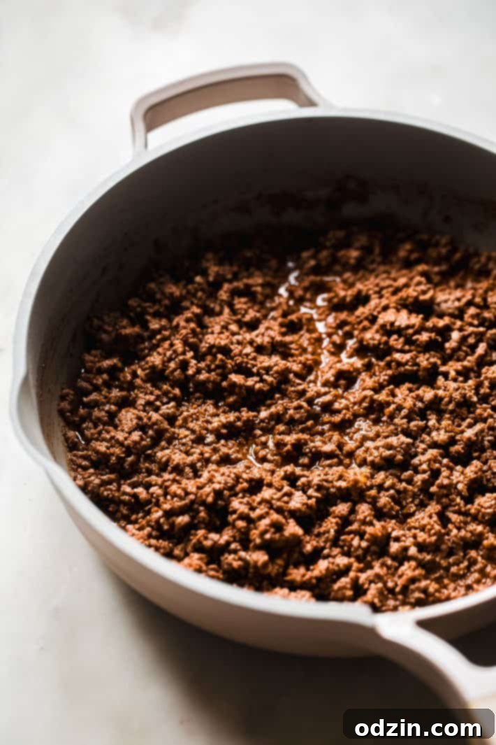 cooked ground beef taco meat in skillet