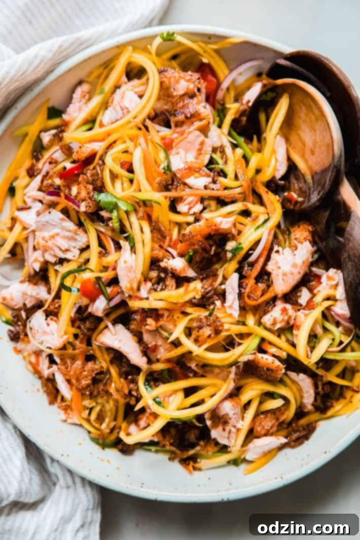 Fiery Thai Rice Crunch Salad 2 crispy rice salad with Thai chili dressing in bowl with wooden spoons