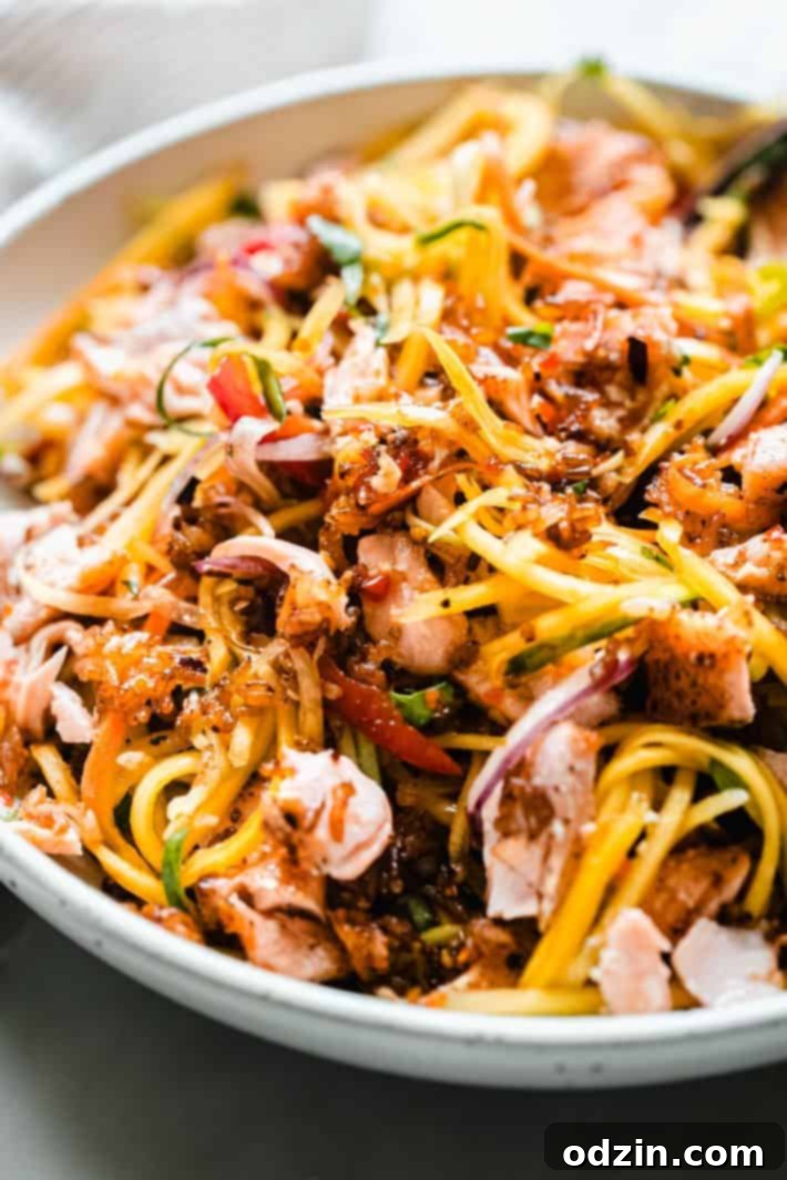 Fiery Thai Rice Crunch Salad 3 shreds of mango with crispy rice tossed with chili dressing