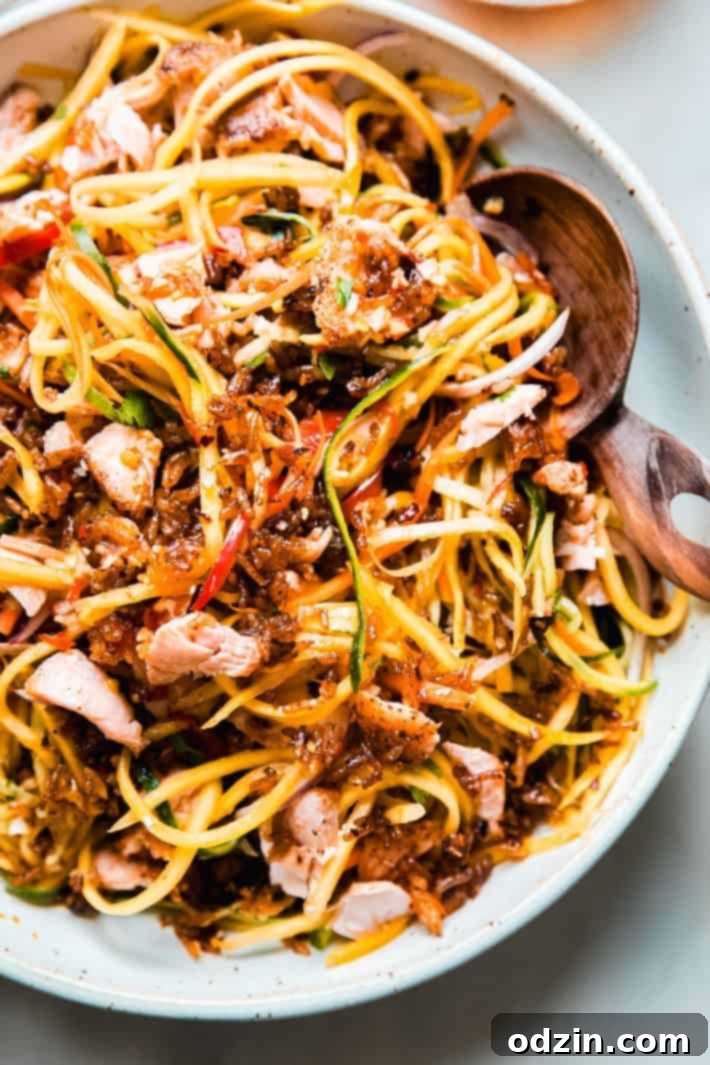 Fiery Thai Rice Crunch Salad 6 shredded salad in bowl topped with flaked salmon