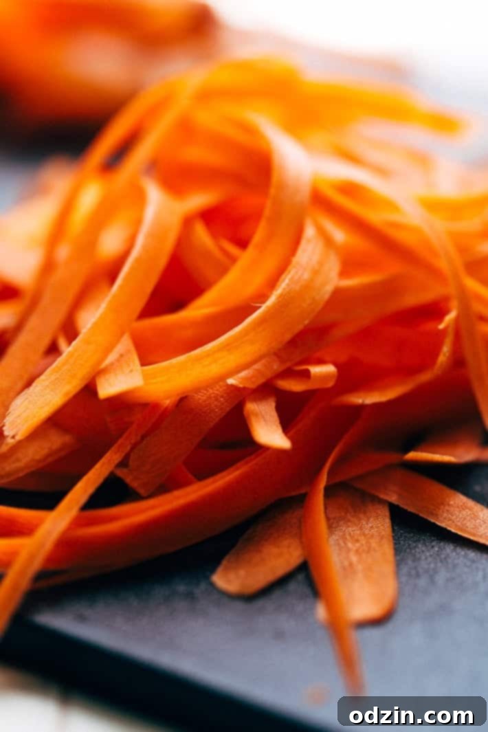 raw carrots peeled into ribbons 