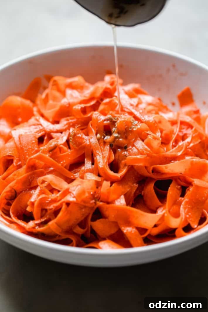 tempered oil pouring on carrot salad