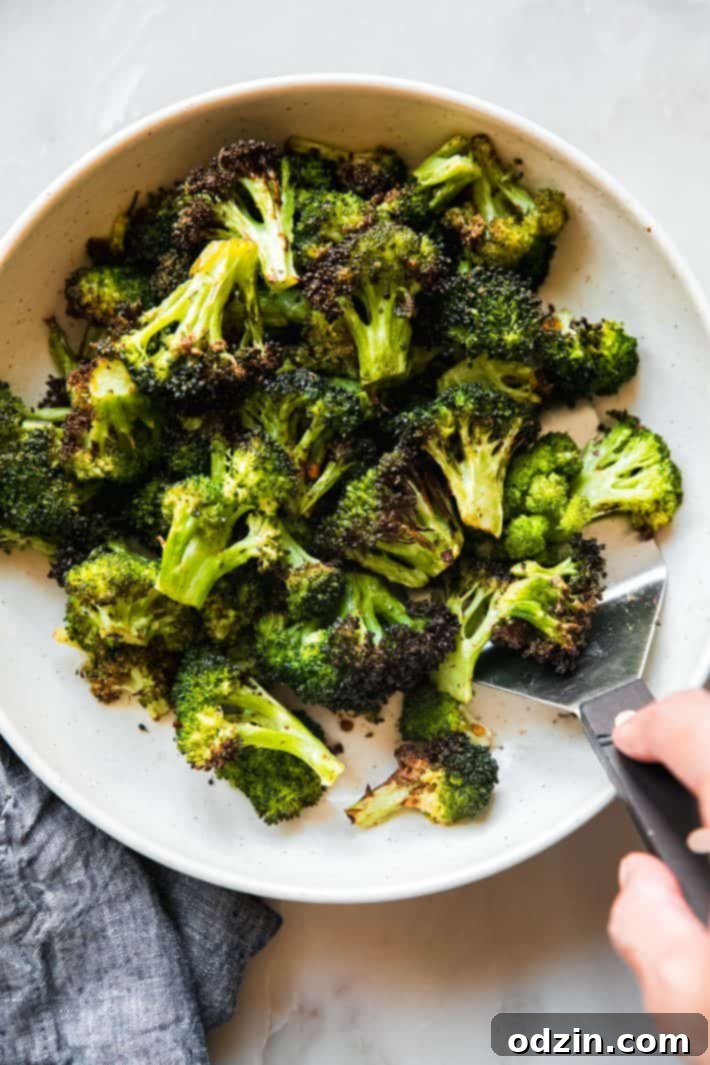 hand lifting spatula with crispy broccoli