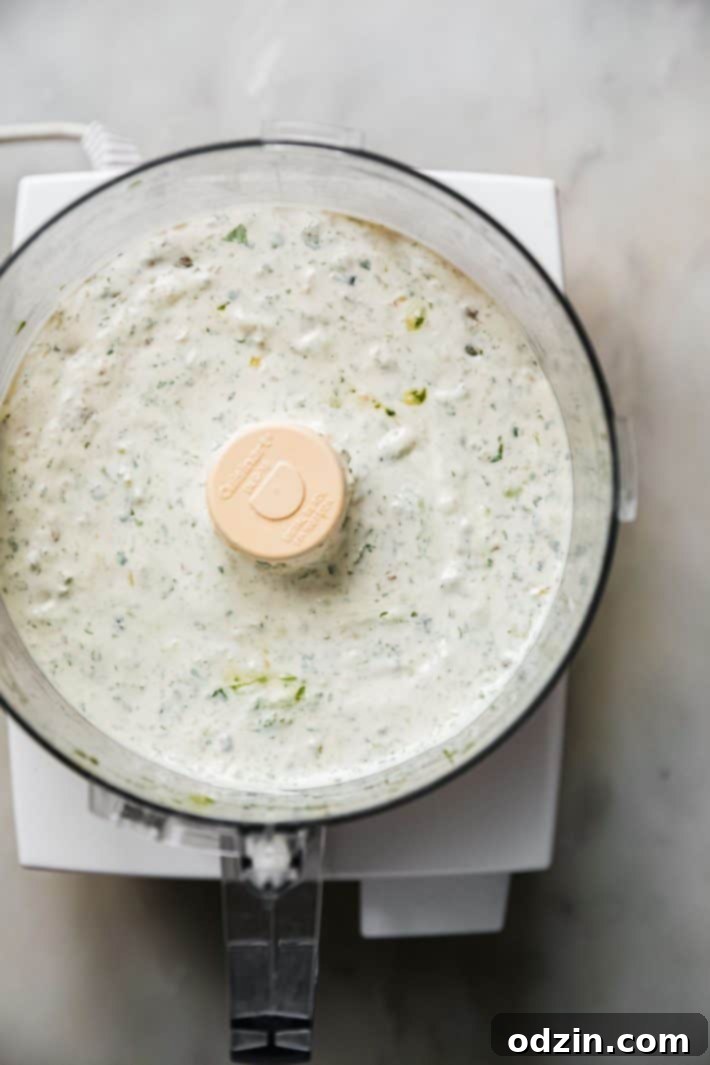 labneh with roasted jalapenos in food processor bowl