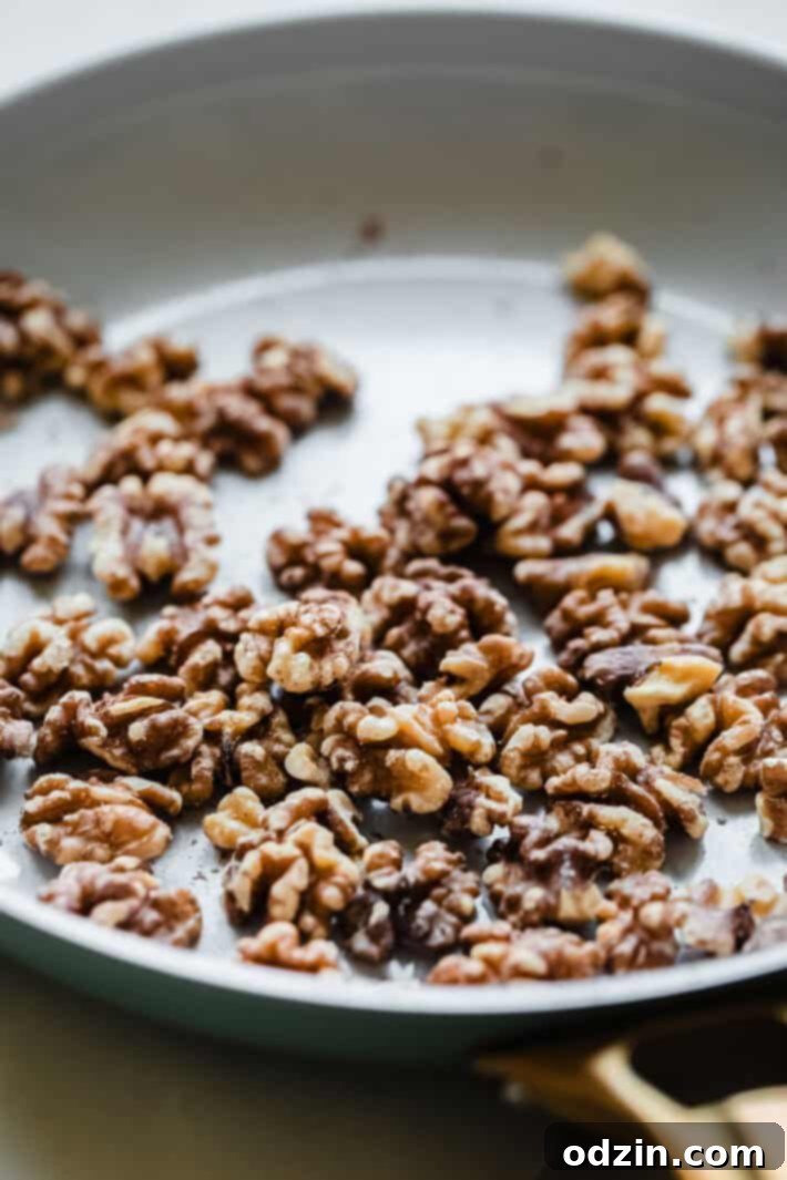 toasted walnuts in pan