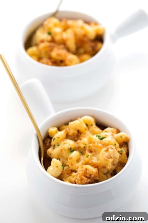 Scoop of creamy mac and cheese on a plate, ready to be enjoyed