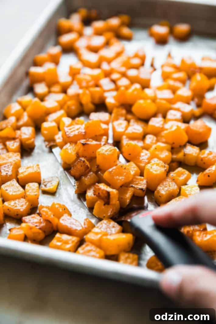 Autumn Glow: Roasted Butternut & Pearl Couscous Salad 5 roasted butternut squash on sheet pan with spatula