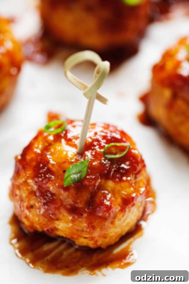 Plated Hawaiian BBQ Chicken Meatballs with fresh pineapple