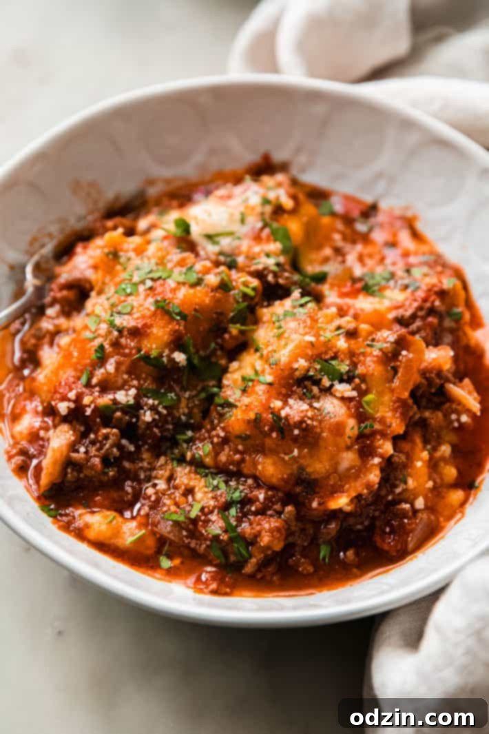 Cheater's Skillet Ravioli Lasagna 6 A beautifully presented bowl of ravioli lasagna, garnished with fresh basil leaves