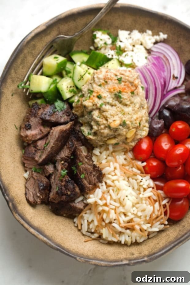 Full spread of Beef Shawarma Bowls with Vermicelli Rice Pilaf, featuring all the delicious toppings and a beautifully presented meal. #shawarma #shawarmabowl #vermicellirice #complete meal