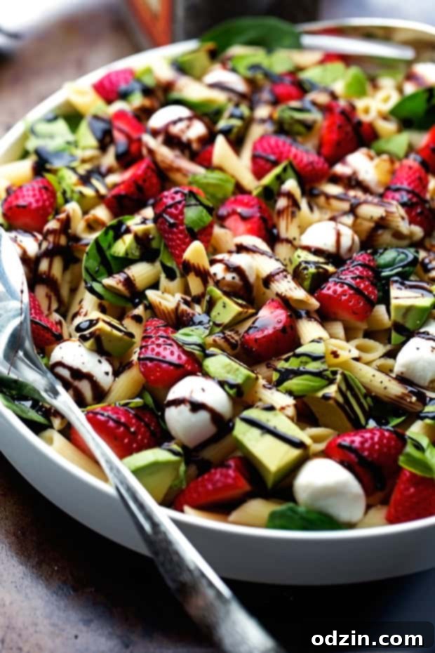 Strawberry Caprese Pasta Salad - Made with a homemade balsamic glaze, this salad is to die for! #pastasalad #capresepastasalad #balsamicglaze | Littlespicejar.com