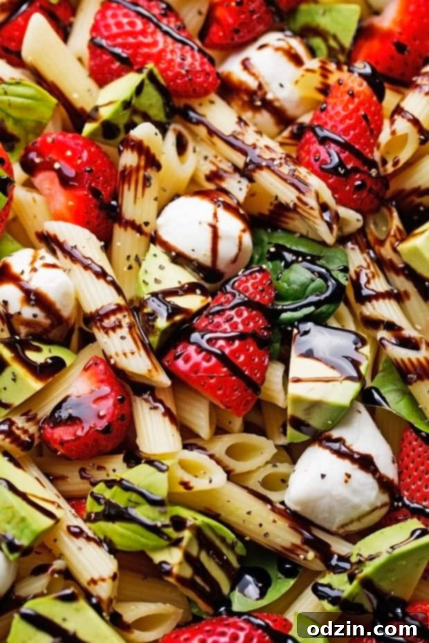 Strawberry Caprese Pasta Salad - Made with a homemade balsamic glaze, this salad is to die for! #pastasalad #capresepastasalad #balsamicglaze | Littlespicejar.com