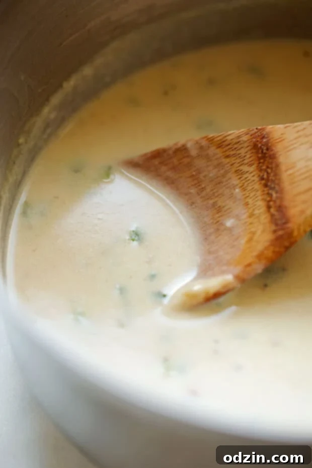 Shrimp Enchiladas with Creamy Poblano Sauce - Simple and delicious shrimp enchiladas stuffed with fresh baby spinach and matchstick carrots. Then drizzle with the creamiest cheese and poblano sauce! #shrimpenchiladas #enchiladas #seafoodenchiladas #mexicanfood | Littlespicejar.com @Littlespicejar poblano cream sauce for enchiladas