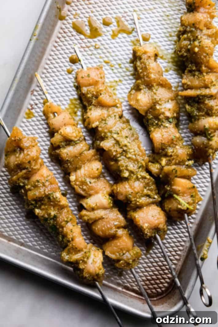 Succulent Chicken Satay with Velvety Peanut Sauce 4 chicken skewers on sheet pan