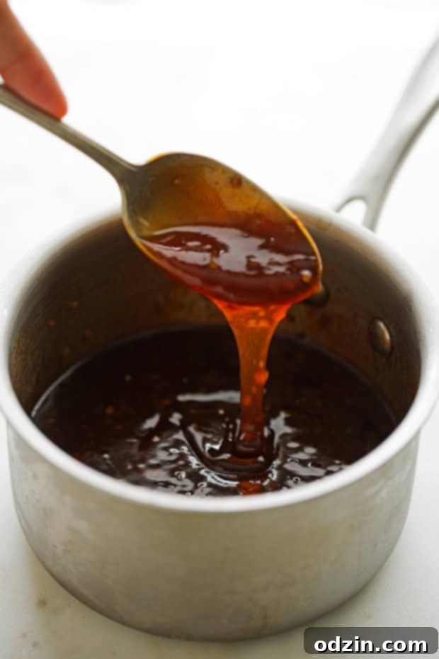 Baked Firecracker Chicken - A quick and easy weeknight dinner recipe! Learn how to make my dynamite firecracker sauce. Serve with rice! #bakedchicken #chicken #dinner #firecrackerchicken #firecrackersauce | Littlespicejar.com