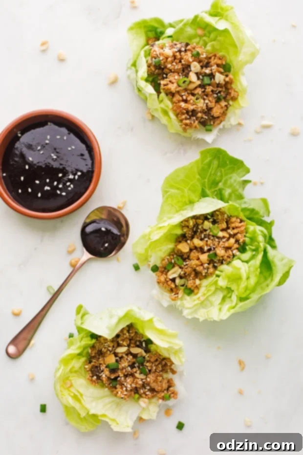 Easy Chicken Lettuce Wraps - Only 100 simple calories in this flavor loaded chicken lettuce wraps that are full of protein and perfect for light and healthy lunches and dinners! #chickenlettucewraps #asianchickenlettucewraps #lettucewraps | Littlespicejar.com