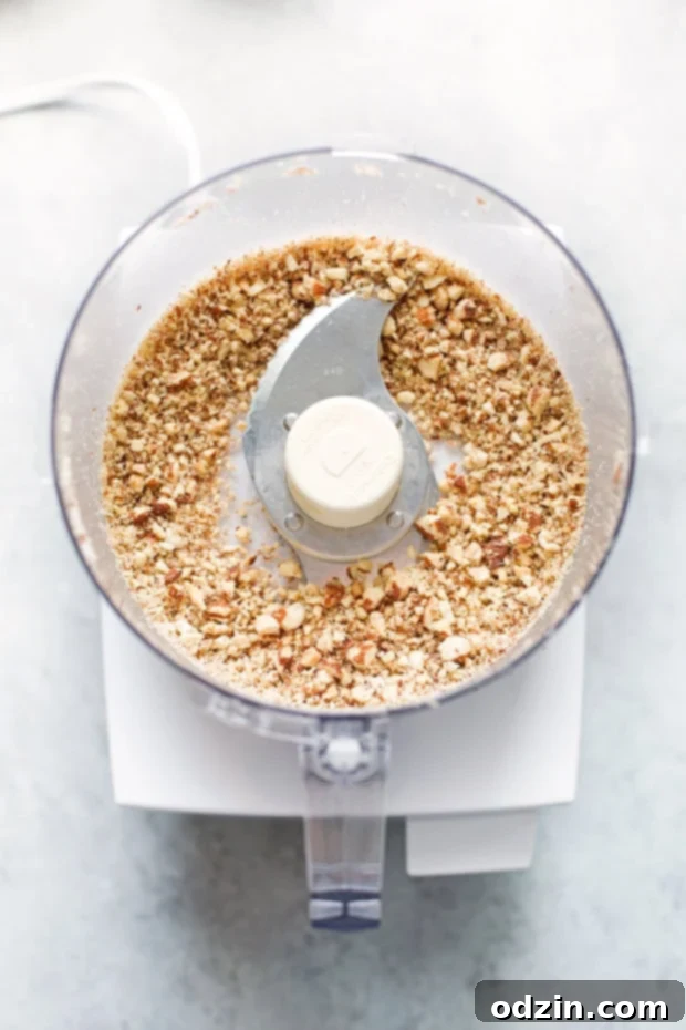 Homemade Refined Sugar-Free Energy Bites: Coconut Almond Flavor Three Coconut Almond Energy Bites showing the delicious sweet and salty combination and crunchy texture.