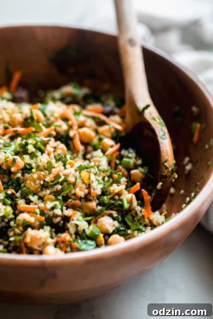 Moroccan Energy Quinoa Bowl 3 bowl of quinoa salad showing carrots, pistachios, chickpeas and parsley