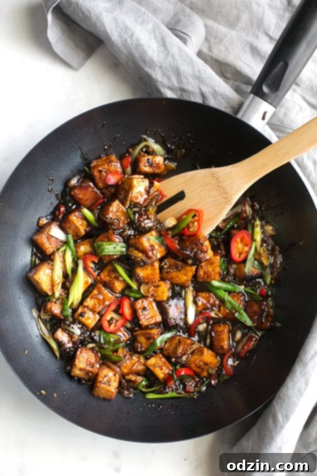 Crispy Black Pepper Tofu Stir Fry - A quick and delicious vegan dinner featuring pan-fried tofu in a spicy black pepper sauce. Perfect for a flavorful weeknight meal. #veganstirfry #stirfry #blackpeppertofu #tofu
