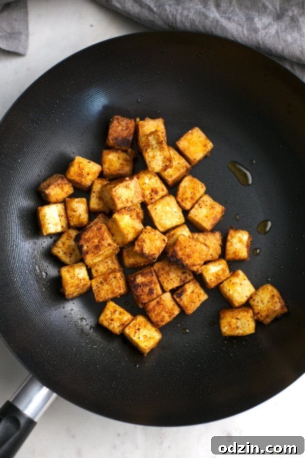 Black Pepper Tofu Stir Fry - Crispy pan-fried tofu coated in a rich, spicy, and savory black pepper sauce. An easy and healthy vegan dinner idea. #veganstirfry #stirfry #blackpeppertofu #tofu