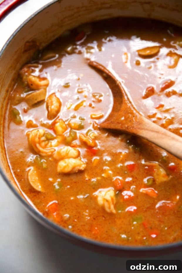 New Orleans Shrimp and Sausage Gumbo 4 wooden spoon in gumbo pot