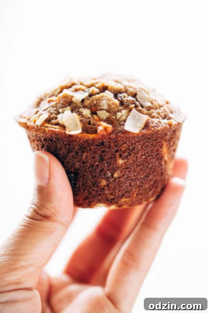 An array of freshly baked Super Moist and Healthy Carrot Cake Muffins, showcasing their uniform shape and appealing texture. A great healthy breakfast option from Littlespicejar.com