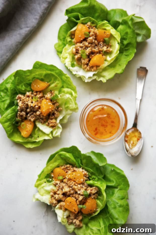Orange Chicken Lettuce Wraps - orange chicken flavored filling in these protein packed lettuce wraps! Healthy, easy AND delicious! #mealprep #lettucewraps #orangechicken | Littlespicejar.com