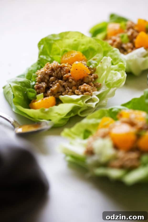 Orange Chicken Lettuce Wraps - orange chicken flavored filling in these protein packed lettuce wraps! Healthy, easy AND delicious! #mealprep #lettucewraps #orangechicken | Littlespicejar.com
