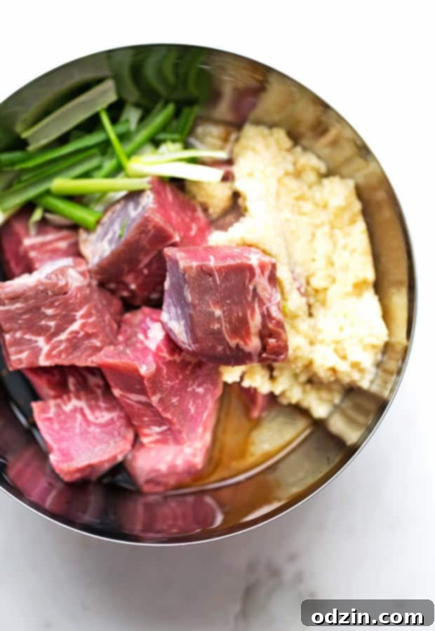 Easy Korean BBQ Beef Skewers with Marinated Steak, Vegetables, and Pineapple Plated Korean Beef Kabobs (Bulgogi) garnished with sesame seeds and scallions, showcasing the perfect grilling marks and inviting presentation.