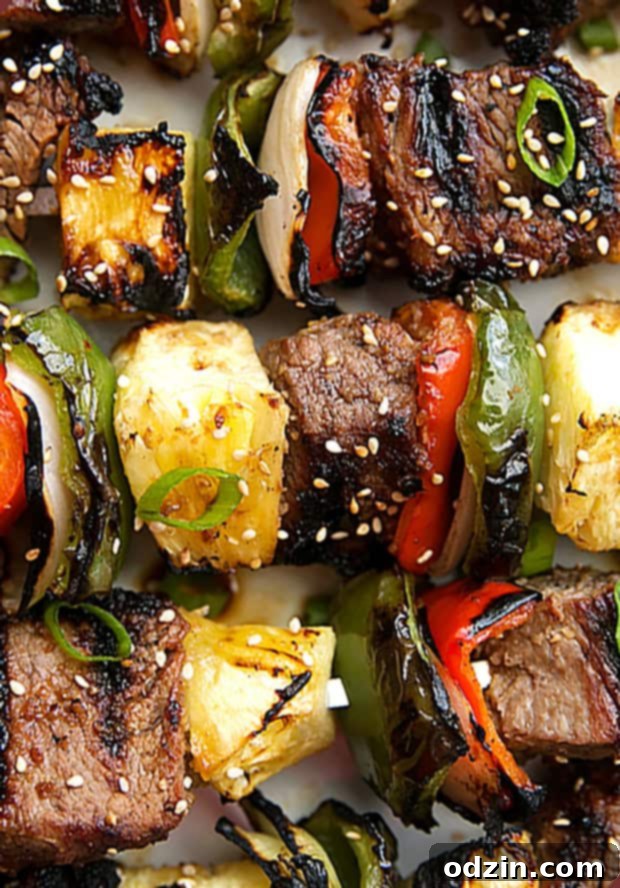 Grilling Korean Beef Kabobs: Easy Bulgogi Skewers Recipe for BBQ Korean Beef Kabobs (Bulgogi) on the grill, showcasing the delightful char on the meat and vegetables, ready to be served.