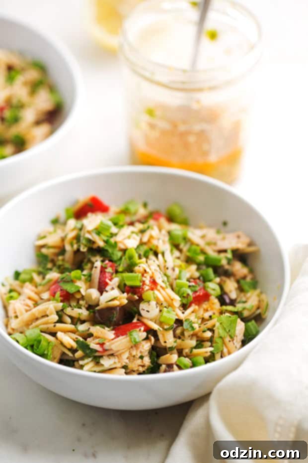 Bowl of vibrant Mediterranean Tuna Orzo Salad ready to be served