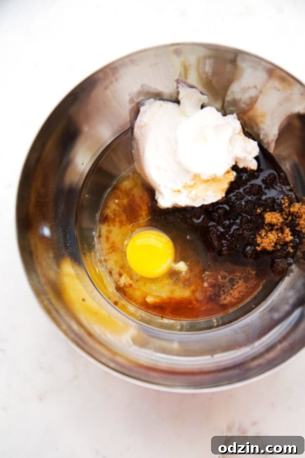 Healthy Zucchini Muffins with Chocolate Chips - Nutrient-packed and perfect for meal prep. Healthy Zucchini Muffins with Chocolate Chips - A stack of freshly baked, wholesome muffins with chocolate chips.